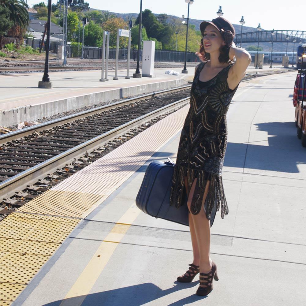 Vintage woman pinup waiting for train black heels dance shoes