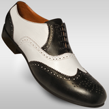 Mens black and white all leather wingtip shoes with a hard leather sole for lindy hop east coast swing and ballroom